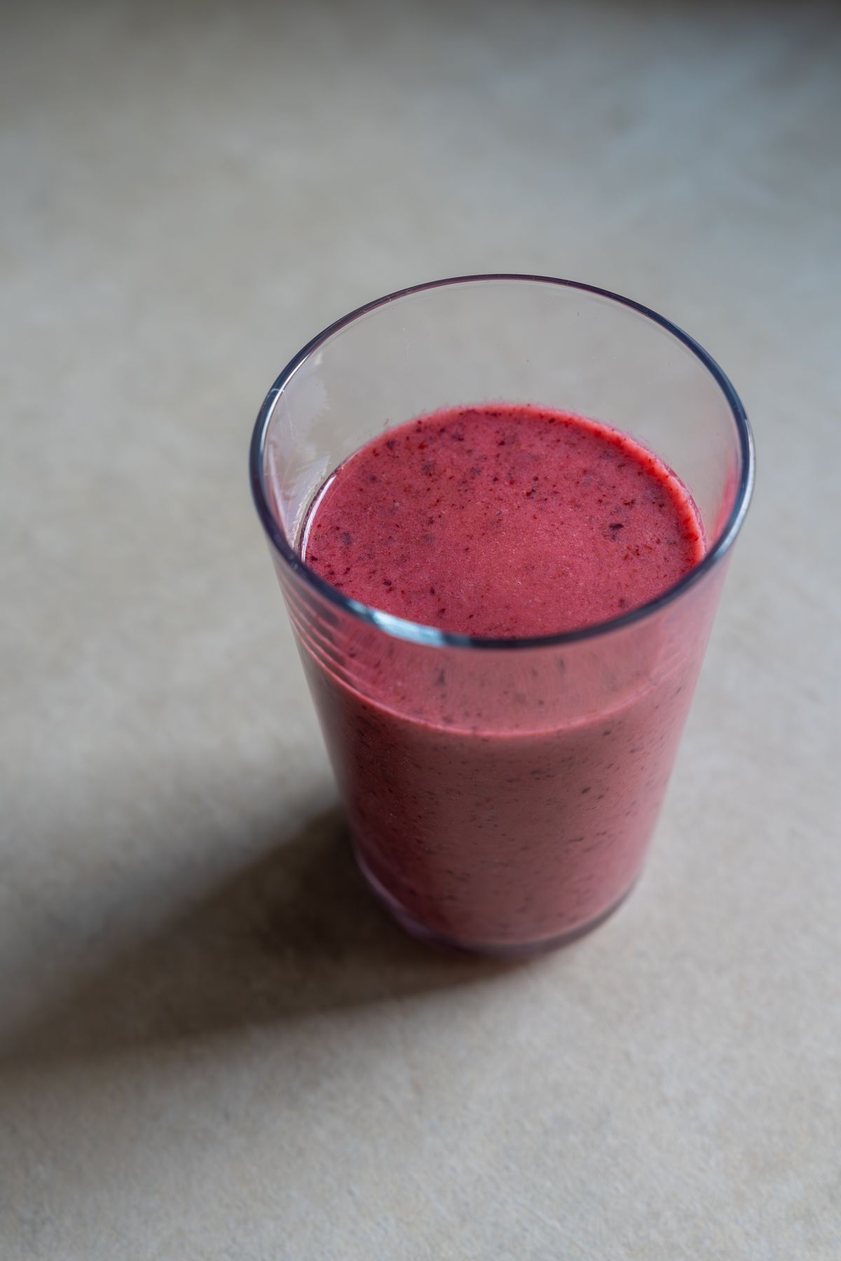 Refreshing berry smoothie in a clear glass